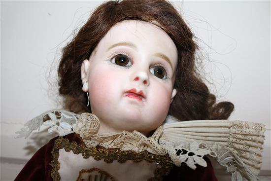 A Jumeau bisque head doll, stamped 7EJ, late 19th century, height 17.5in., small firing crack to right ear
